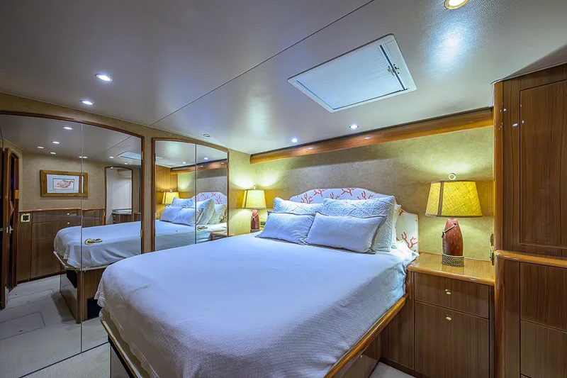 Slide: The Image of Luxurious bedroom interior of 2007 Viking 68 Convertible yacht with elegant lighting and wood finishes. - 13