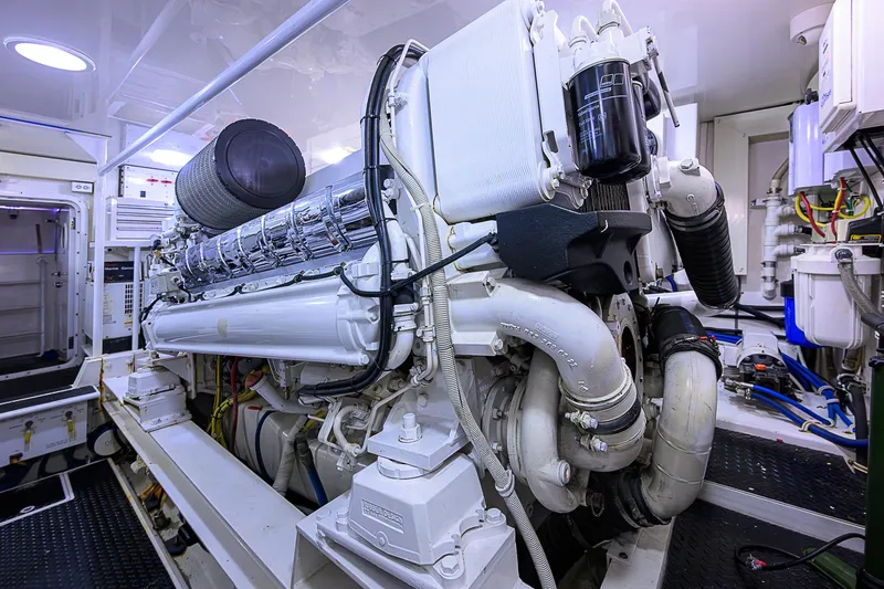 Slide: The Image of Engine room of a 2007 Viking 68 Convertible yacht, showcasing powerful machinery. - 16