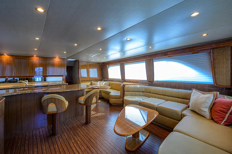 Slide: The Image of Luxurious interior of 2007 Viking 68 Convertible yacht with elegant seating and wooden finishes. - 3