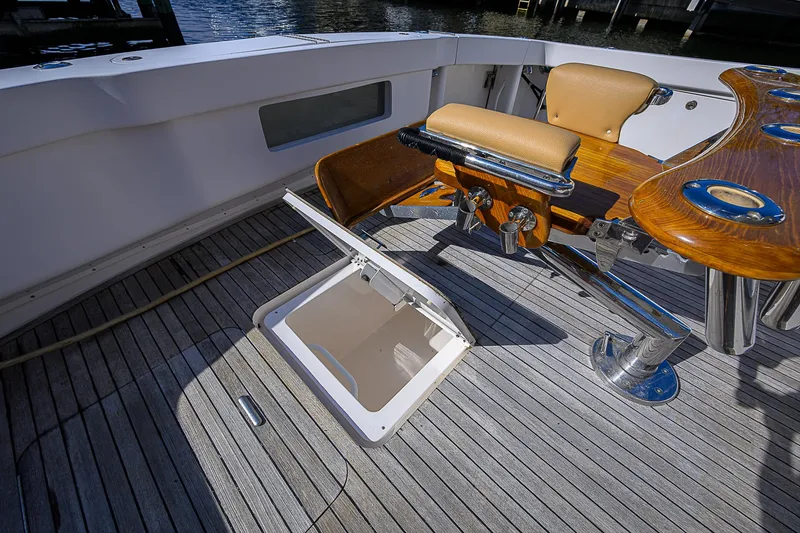 Slide: The Image of 2007 Viking 68 Convertible yacht deck with fishing chair and open hatch. - 33