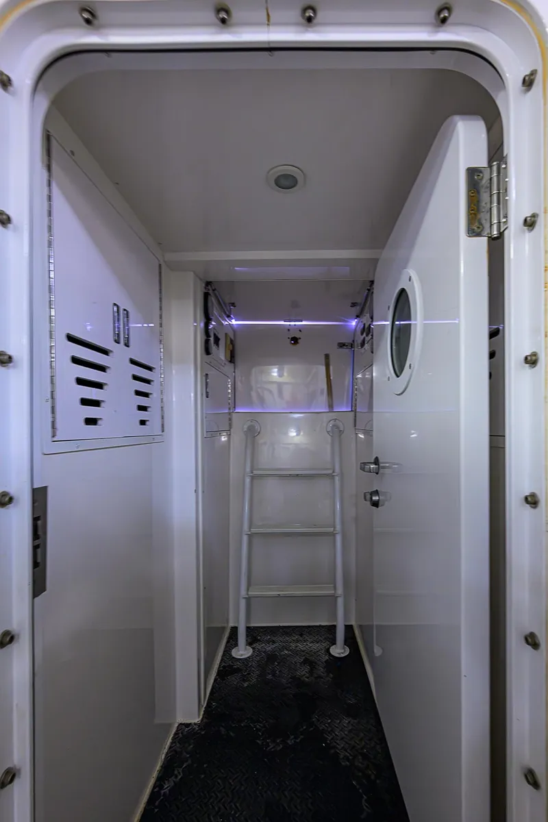 Slide: The Image of Interior of 2007 Viking 68 Convertible yacht with ladder and porthole door. - 43