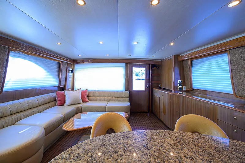 Slide: The Image of Luxurious interior of a 2007 Viking 68 Convertible yacht with elegant seating and modern decor. - 5