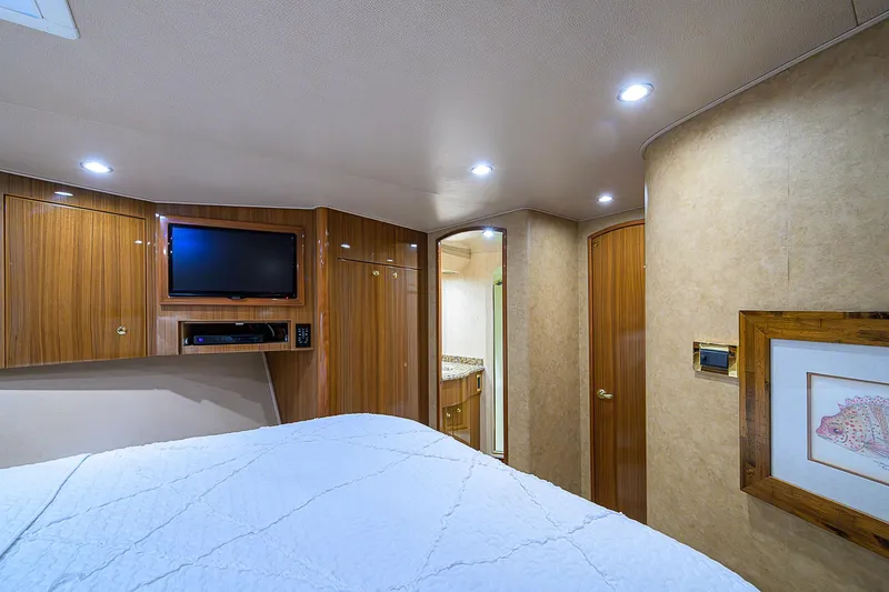 Slide: The Image of Luxurious cabin interior of 2007 Viking 68 Convertible yacht with TV and modern amenities. - 6