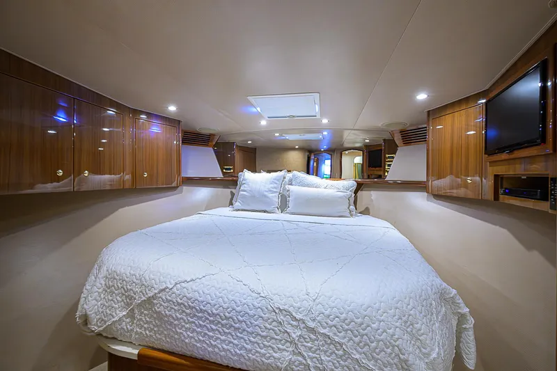 Slide: The Image of Luxurious bedroom interior of 2007 Viking 68 Convertible yacht with elegant wood cabinetry. - 7