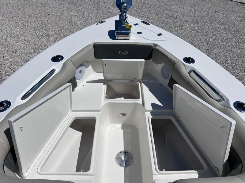Slide: The Image of 2025 Key West 239 DFS boat with open storage compartments on deck. - 11