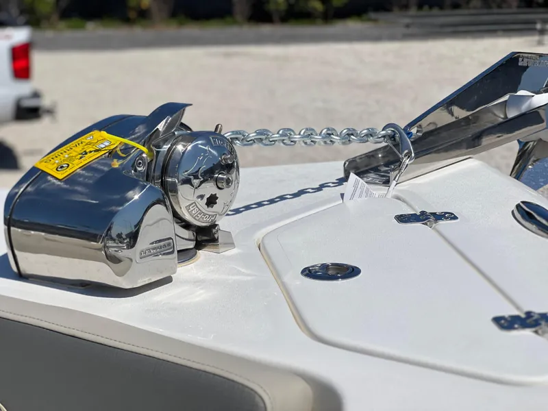 Slide: The Image of Anchor system on 2025 Key West 239 DFS boat, featuring polished metal components. - 12