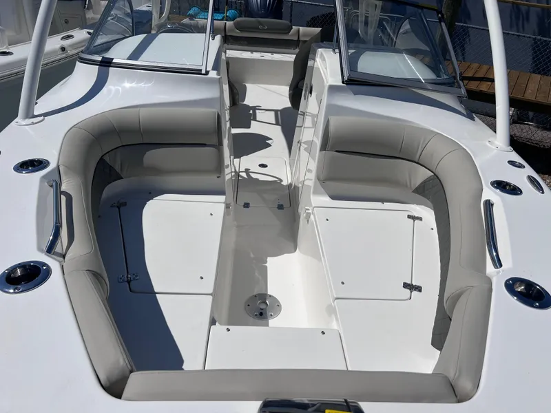 Slide: The Image of 2025 Key West 239 DFS boat interior with spacious seating and sleek design. - 13