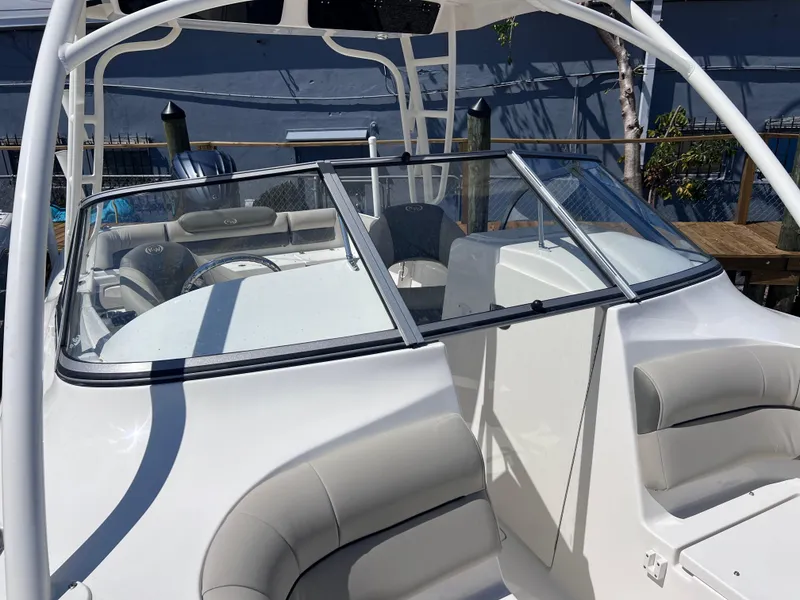 Slide: The Image of 2025 Key West 239 DFS boat interior with seating and windshield. - 14