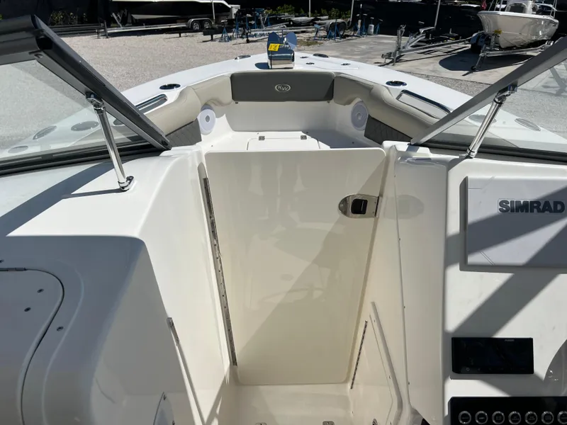 Slide: The Image of 2025 Key West 239 DFS boat interior with Simrad electronics and open deck view. - 15