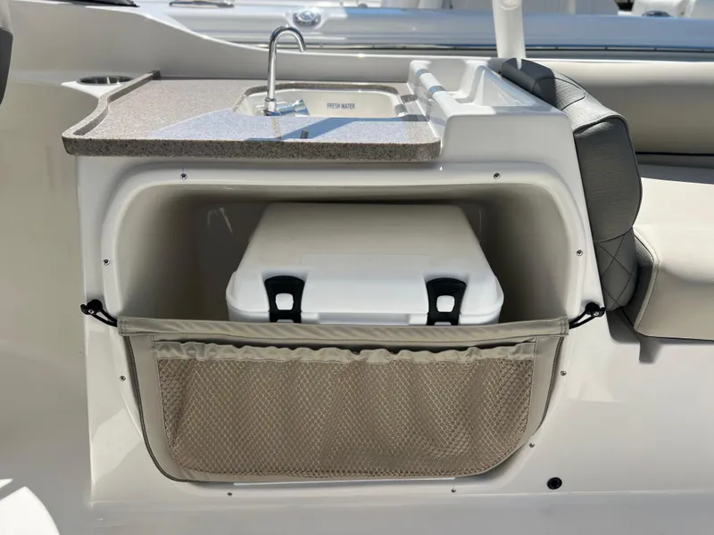 Slide: The Image of 2025 Key West 239 DFS boat interior with sink and storage compartment. - 33