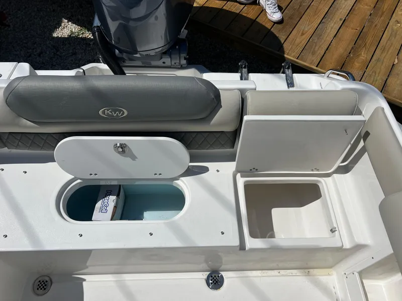 Slide: The Image of 2025 Key West 239 DFS boat interior with storage compartments and seating. - 34