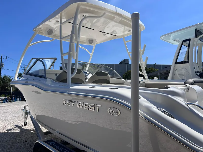 Slide: The Image of 2025 Key West 239 DFS boat with sleek design and modern features under a clear blue sky. - 6