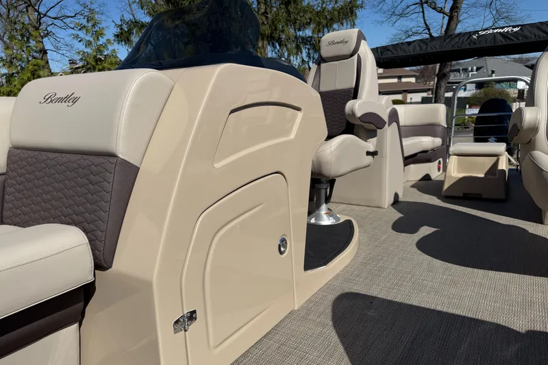 Slide: The Image of 2025 Bentley Pontoons Elite 253 Admiral interior with luxurious seating and modern design. - 19