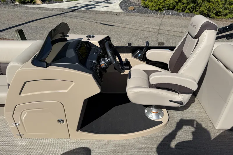 Slide: The Image of 2025 Bentley Pontoons Elite 253 Admiral helm with luxurious captain's chair and modern controls. - 20