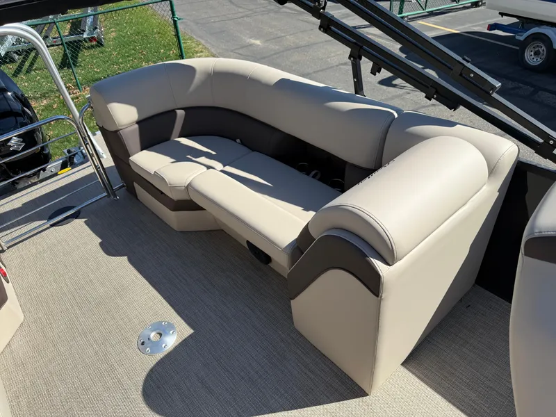 Slide: The Image of 2025 Bentley Pontoons Elite 253 Admiral interior with beige seating and carpeted flooring. - 33