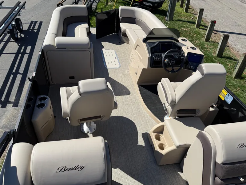 Slide: The Image of 2025 Bentley Pontoons Elite 253 Admiral interior with luxurious seating and modern dashboard. - 37