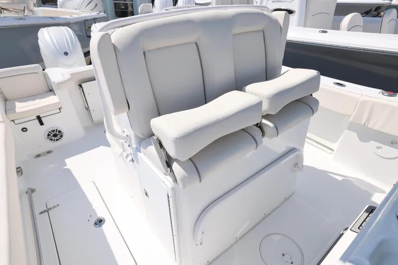 Slide: The Image of Luxury seating on 2026 Sea Hunt Gamefish 27 Coffin Box boat, featuring plush white cushions. - 18