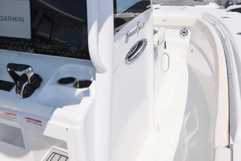 Slide: The Image of 2026 Sea Hunt Gamefish 27 Coffin Box boat interior with cushioned seating. - 19