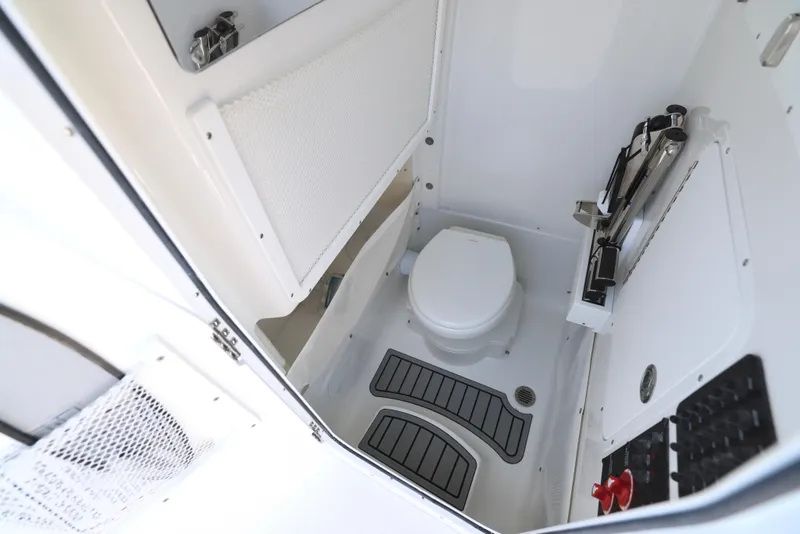 Slide: The Image of 2026 Sea Hunt Gamefish 27 Coffin Box boat console with Garmin electronics and radio. - 22