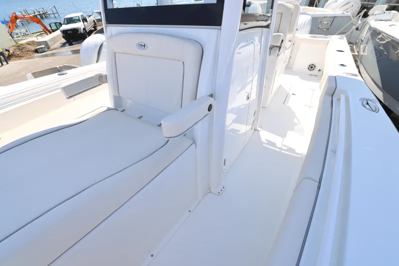 Slide: The Image of 2026 Sea Hunt Gamefish 27 Coffin Box boat interior with steering wheel and console. - 24