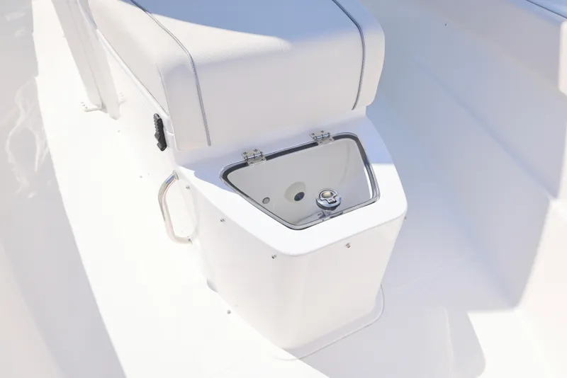 Slide: The Image of 2026 Sea Hunt Gamefish 27 Coffin Box boat interior with white seating and storage. - 25