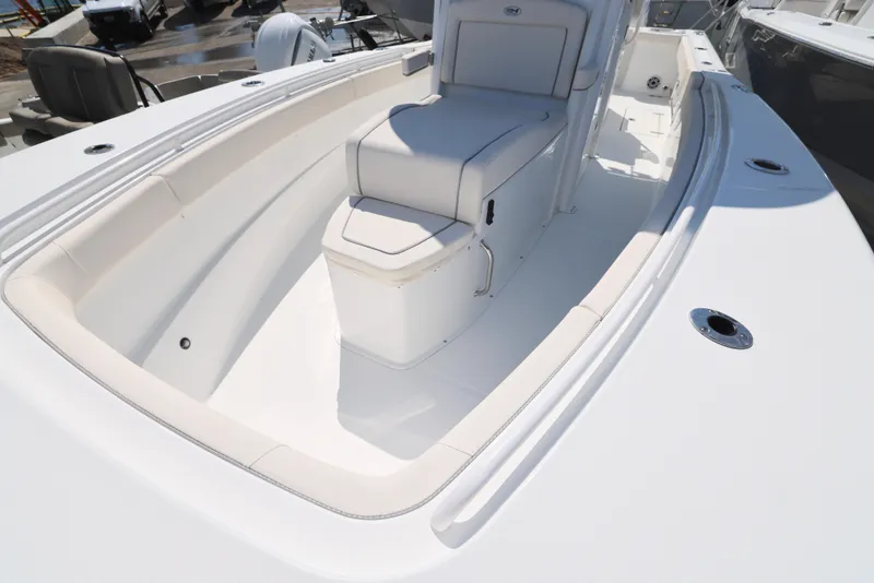 Slide: The Image of 2026 Sea Hunt Gamefish 27 Coffin Box boat interior with seating and speakers. - 27