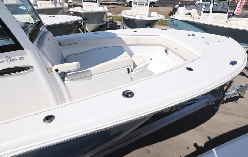 Slide: The Image of 2026 Sea Hunt Gamefish 27 Coffin Box boat interior with seating and storage. - 28