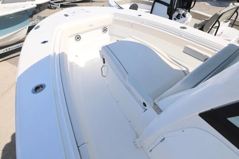 Slide: The Image of 2026 Sea Hunt Gamefish 27 Coffin Box boat, white interior, docked in a marina. - 29