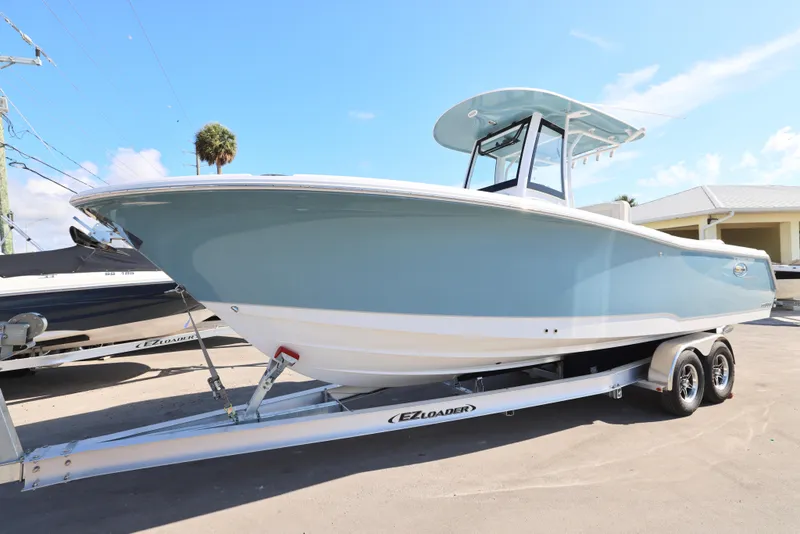 Slide: The Image of 2026 Sea Hunt Gamefish 27 Coffin Box boat on trailer, side view. - 32