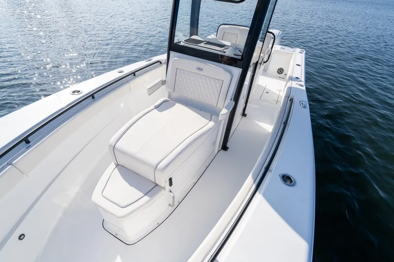 Slide: The Image of 2026 Sea Hunt Gamefish 27 Coffin Box boat on water, featuring sleek white design. - 36
