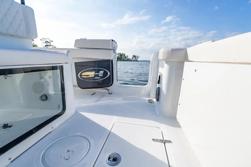Slide: The Image of 2026 Sea Hunt Gamefish 27 Coffin Box boat interior with seating and storage compartments. - 47