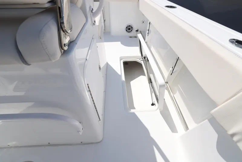 Slide: The Image of 2026 Sea Hunt Gamefish 27 Coffin Box boat interior with seating and dual engines. - 8