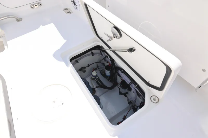 Slide: The Image of Interior view of 2026 Sea Hunt Gamefish 27 Coffin Box boat, featuring storage compartment. - 9