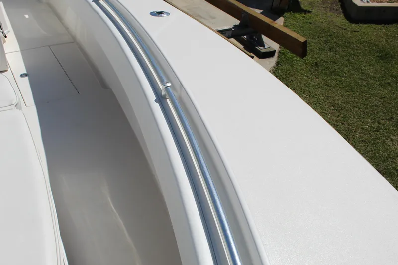 Slide: The Image of 2002 Contender 31 CC boat deck with stainless steel railing. - 26