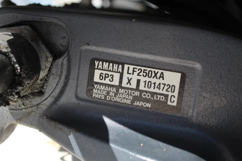 Slide: The Image of Yamaha LF250XA engine label on a 2002 Contender 31 CC boat. - 48