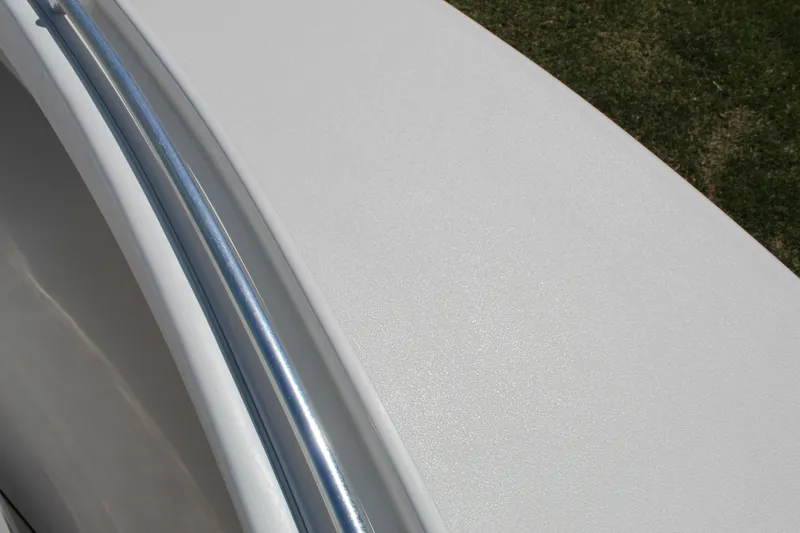 Slide: The Image of 2002 Contender 31 CC boat deck with metal railing, close-up view. - 9