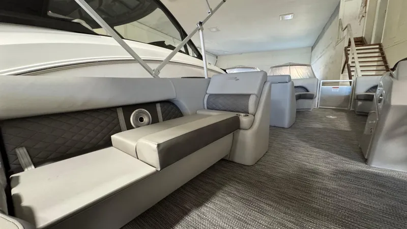 Slide: The Image of 2023 Bennington 25 LSB boat interior with luxurious seating and modern design. - 12