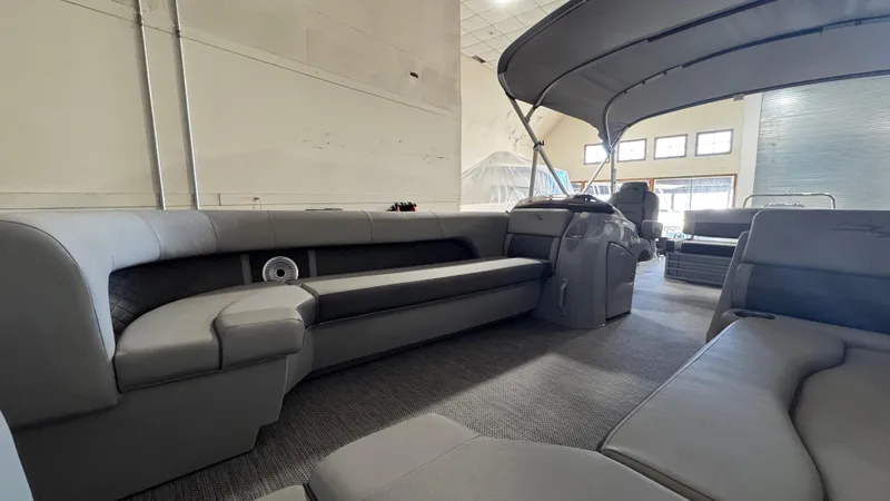 Slide: The Image of 2023 Bennington 25 LSB pontoon boat interior with spacious seating and modern design. - 23