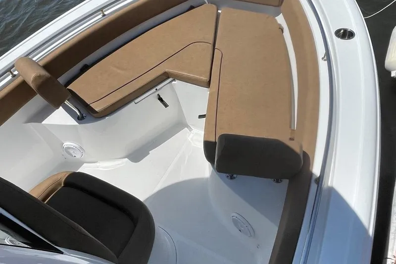 Slide: The Image of 2021 Sea Hunt 239 Ultra SE boat with tan seating and white deck. - 11