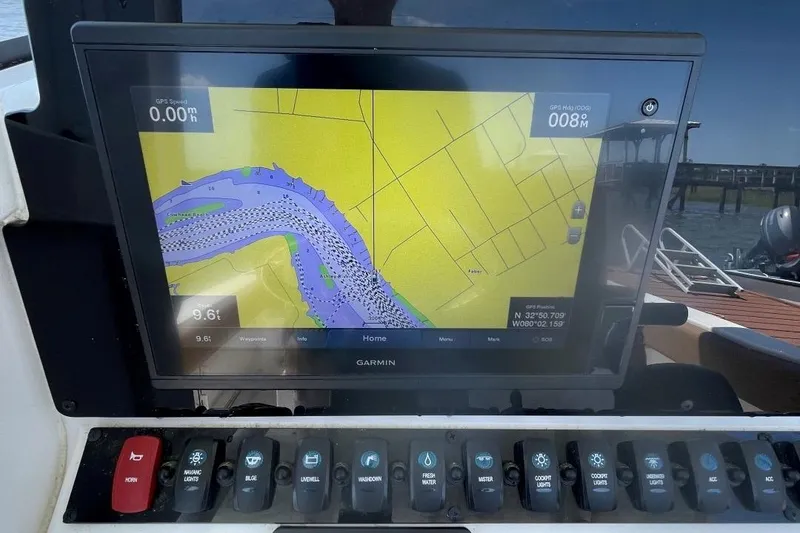 Slide: The Image of Garmin navigation display on 2021 Sea Hunt 239 Ultra SE boat dashboard. - 22