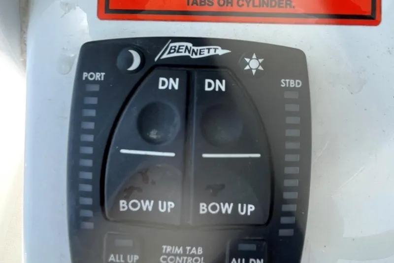 Slide: The Image of Bennett trim tab control panel on 2021 Sea Hunt 239 Ultra SE boat. - 26