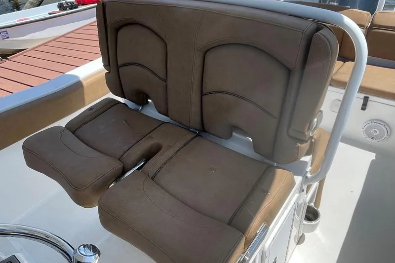 Slide: The Image of Brown cushioned seating on 2021 Sea Hunt 239 Ultra SE boat deck. - 28
