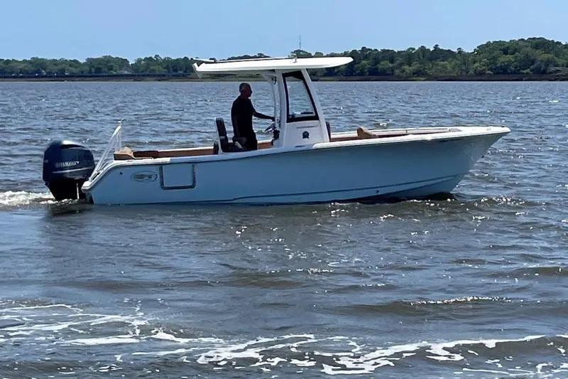Slide: The Image of 2021 Sea Hunt 239 Ultra SE boat cruising on a sunny day. - 3