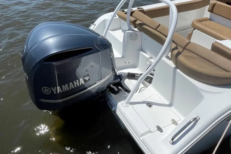 Slide: The Image of 2021 Sea Hunt 239 Ultra SE boat with Yamaha outboard motor on water. - 35