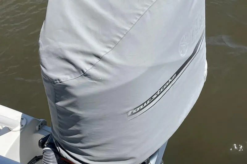 Slide: The Image of Protective cover on a 2021 Sea Hunt 239 Ultra SE boat engine. - 37