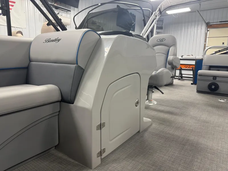 Slide: The Image of 2025 Bentley Pontoons Legacy 240 Cruise interior with plush seating and modern design. - 10
