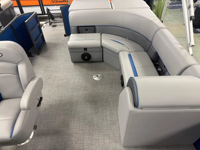Slide: The Image of 2025 Bentley Pontoons Legacy 240 Cruise interior with gray seating and blue accents. - 11