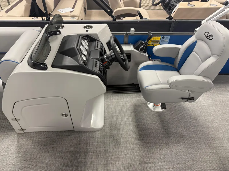 Slide: The Image of 2025 Bentley Pontoons Legacy 240 Cruise helm with modern controls and comfortable captain's chair. - 12