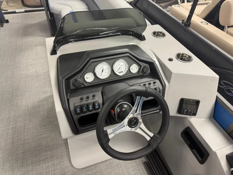 Slide: The Image of 2025 Bentley Pontoons Legacy 240 Cruise dashboard with steering wheel and gauges. - 14