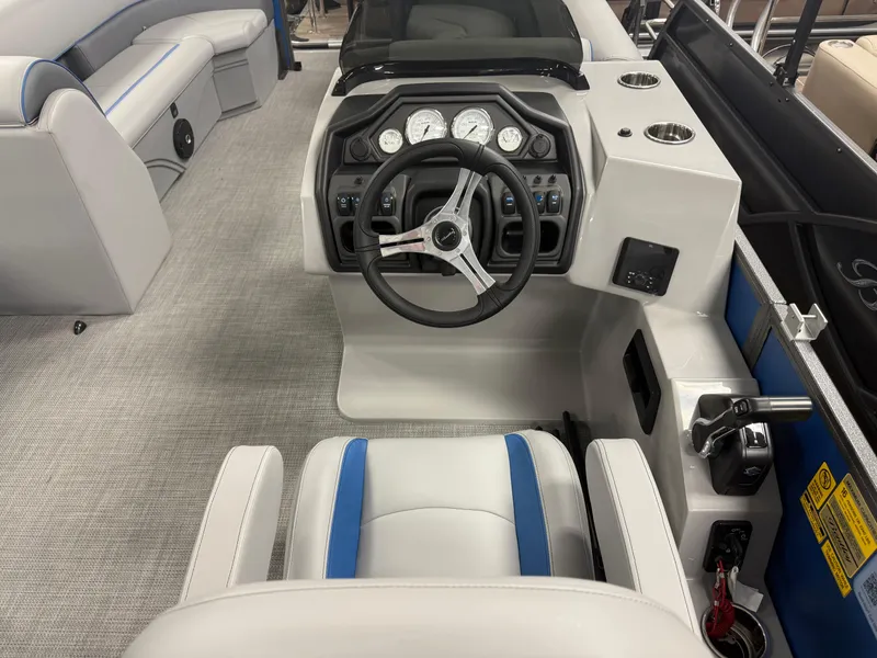 Slide: The Image of 2025 Bentley Pontoons Legacy 240 Cruise interior with modern dashboard and steering wheel. - 15